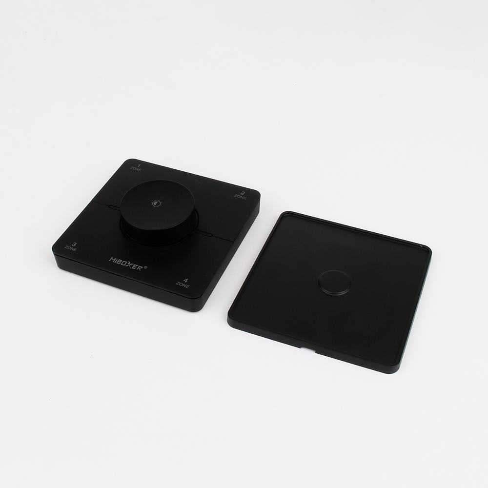 MiBoxer K0S CCT LED Wandfernbedienung Schwarz 2.4GHz Drehregler mit Montageplatte und Komponenten MiBoxer K0S CCT LED Wandfernbedienung in Schwarz mit Drehregler und separater Montageplatte zur Installation und Steuerung von LED Streifen über 2.4GHz Funk